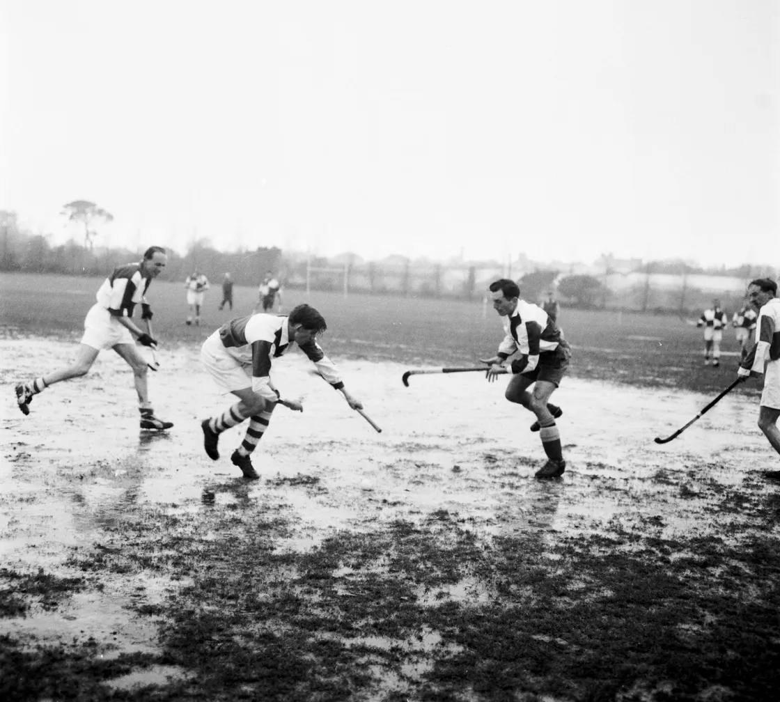 Sticks stuck: Hockey in the KGV mud in 1962.