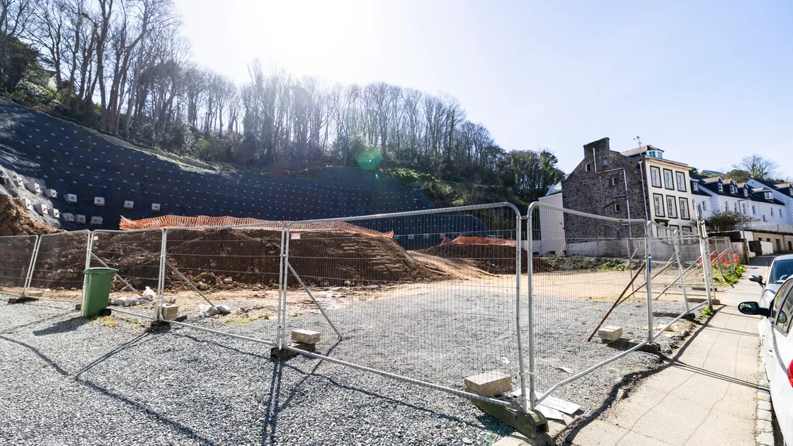 Cliff stabilisation work has finished at the former CI Tyres site on La Charroterie, paving the way for flat-building to finally start.