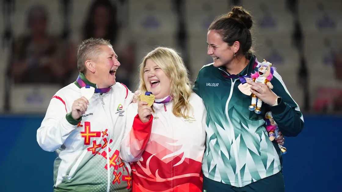 All smiles on the podium after yesterday’s women’s bowls concluded at the Glasgow Commonwealth Games. Silver and bronze in the women’s singles got both Guernsey, through Alison Merrien (left), and the Norfolk Islands, with Shae Wilson, on the medal table at the last. They flank gold medal winner England’s Katherine Rednall.