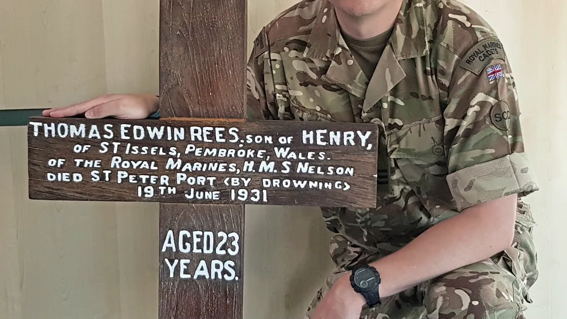Matt Hill with the restored cross. (29664110)