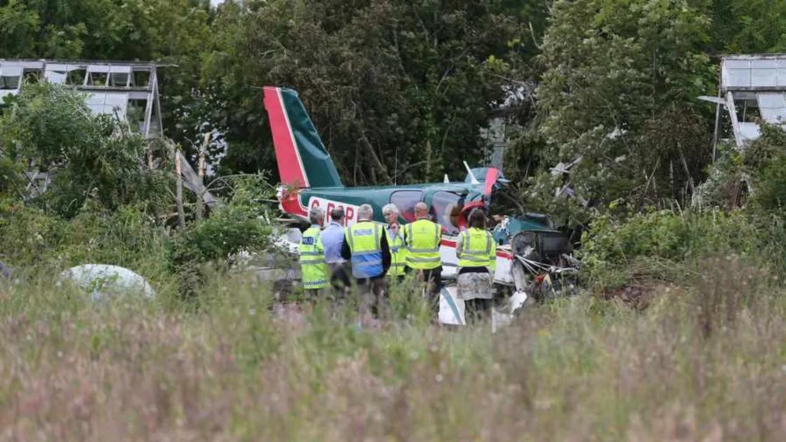 Pilot returns to plane crash scene while wife remains in hospital