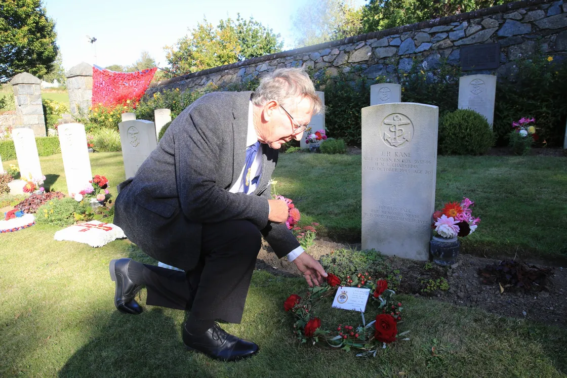 Pic by Adrian Miller 27-09-20 Foulon Cemetery. Remembrance service for H.M.S. Charybdis and H.M.S. Limbourne . Peter Carey member of the Charybdis and Limbourne Association lays a wreath.. (28735087)