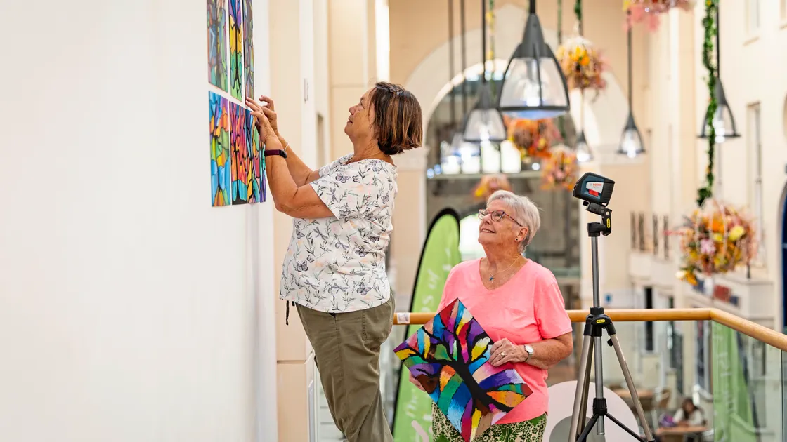 L-R: Caroline Robilliard and Karen Langlois helping to set up the exhibition.