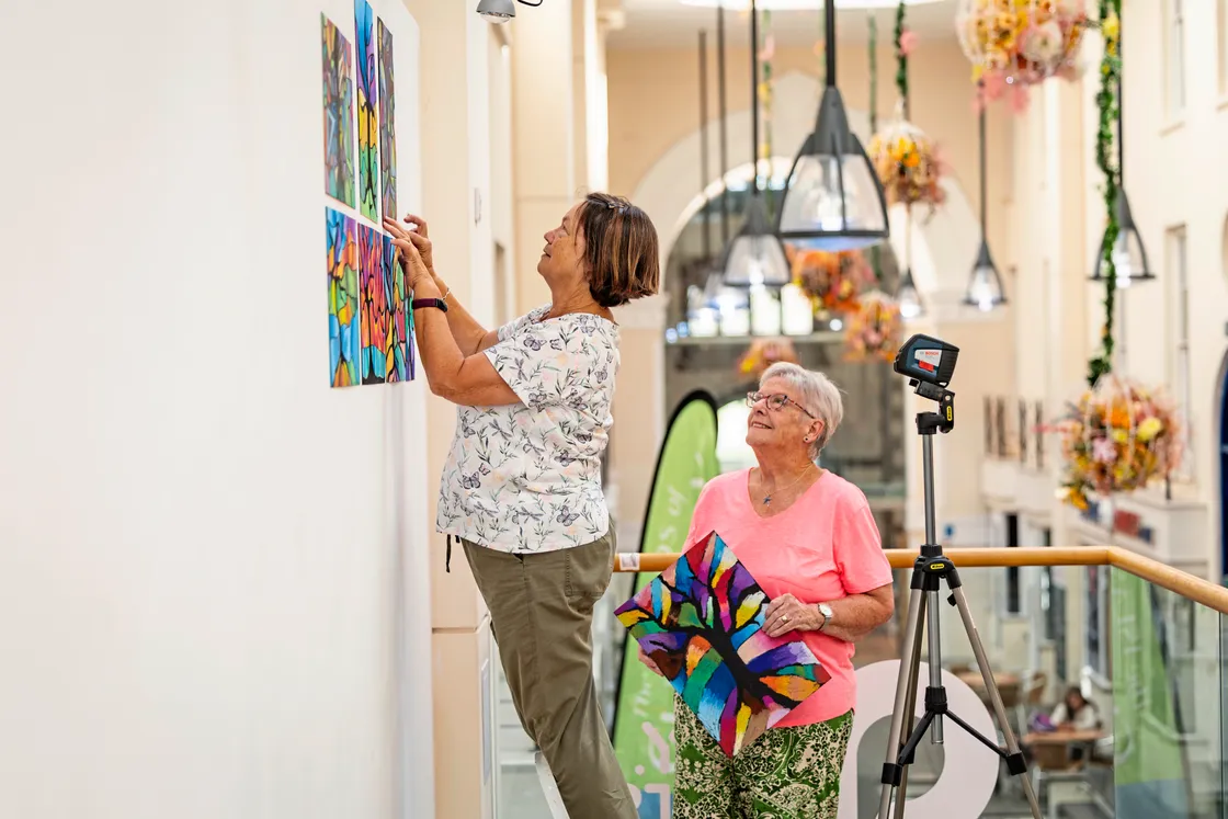 L-R: Caroline Robilliard and Karen Langlois helping to set up the exhibition.