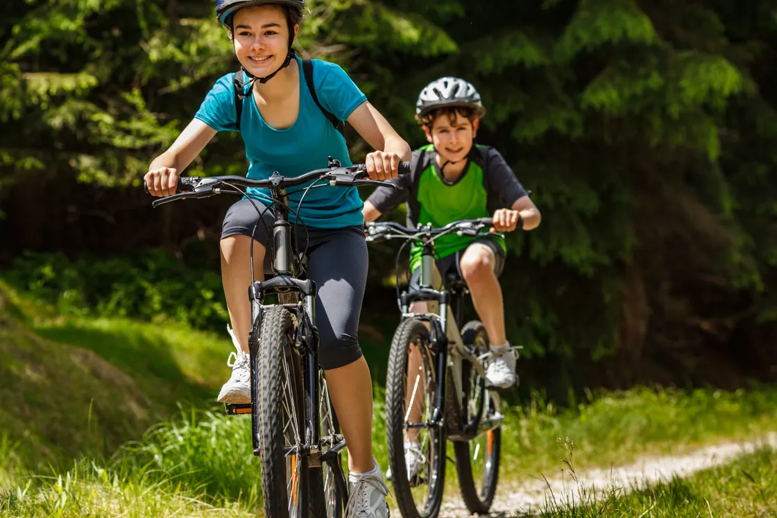 How was the age of 14 determined to be the correct minimum age for riding an e-bike?
