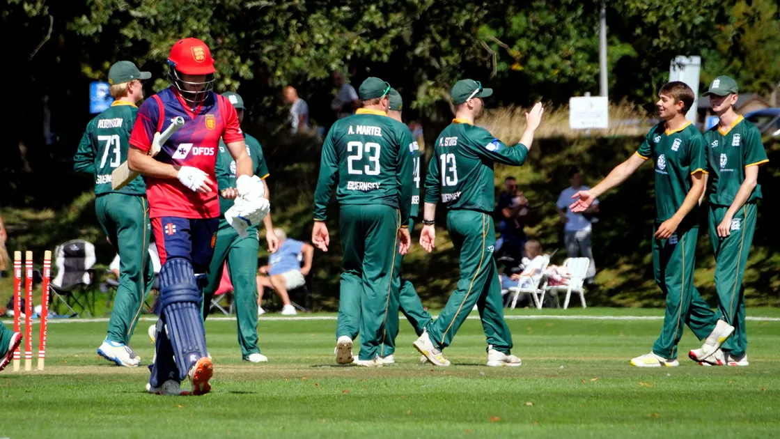 Guernsey celebrate the wicket of Jersey batter Zak Tribe after he was bowled by Charlie Forshaw on Saturday at Grainville.