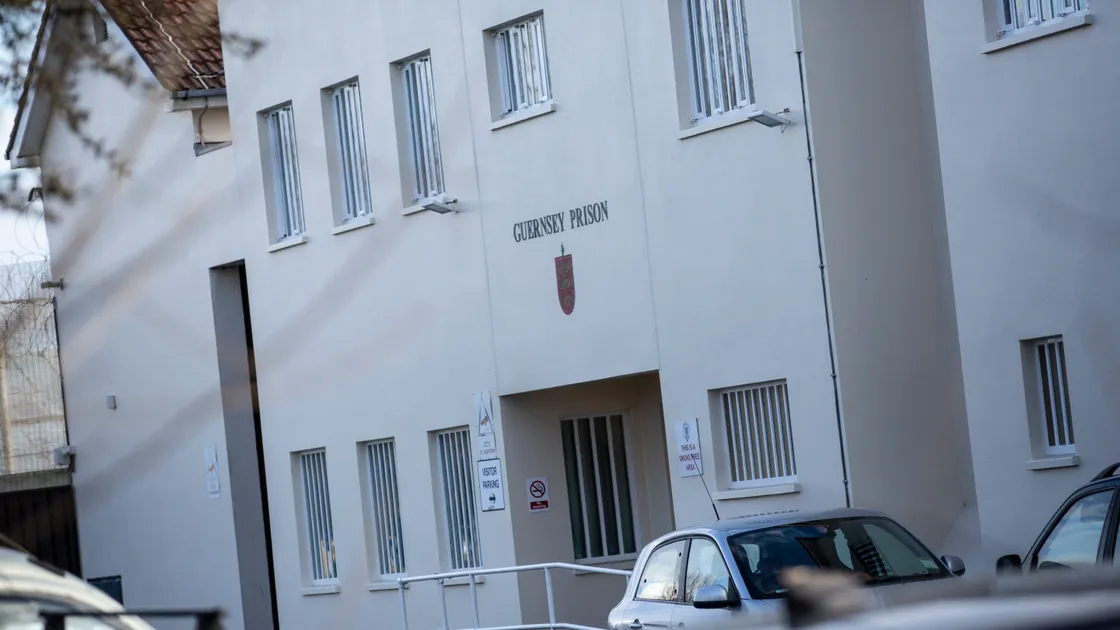 Prison governor John de Carteret confirmed that a member of his staff had been suspended