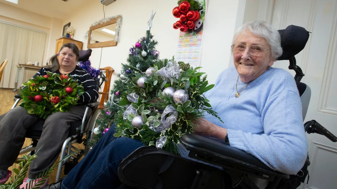 Guernsey Cheshire Home residents Rosie Le Maitre, left, and Angela Gaskill are among those who have been making Christmas wreaths to sell at its annual fayre, which will be held at the home for the first time.(Picture by Peter Frankland, 26532210)