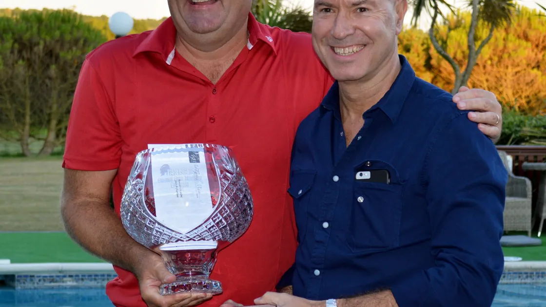 The 2018 Ravenscroft Guernsey Open Matchplay winner, former Ryder cup player Steve Richardson, receives the trophy from Paul Matthews. (Picture by Gareth Le Prevost, 24610204)