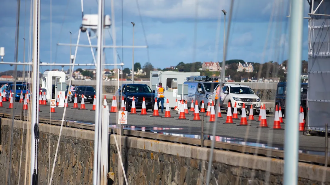 Car passengers queue off the Condor Liberation yesterday. Queues on Sunday took hours to clear Covid arrivals. (Picture by Peter Frankland, 30036830)