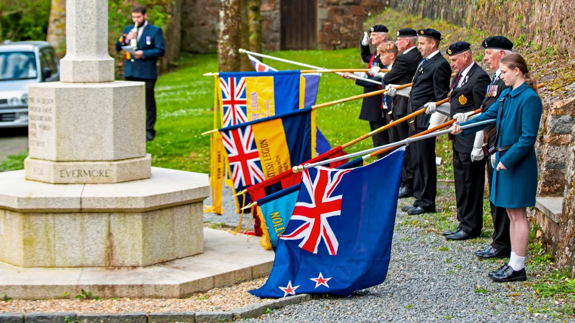 Standards are lowered as the island marks Anzac Day for the 13th time with a service at Fort George. The standard bearers included children of Australian and New Zealand families. (Pictures by Sophie Rabey, 33175677)