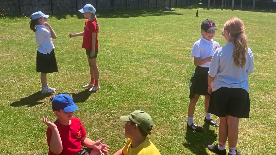 Pupils at Amherst Primary School being filmed demonstrating Guernesiais Rock, Paper, Scissors for the Let’s Play in Guernesiais learning resource last summer
