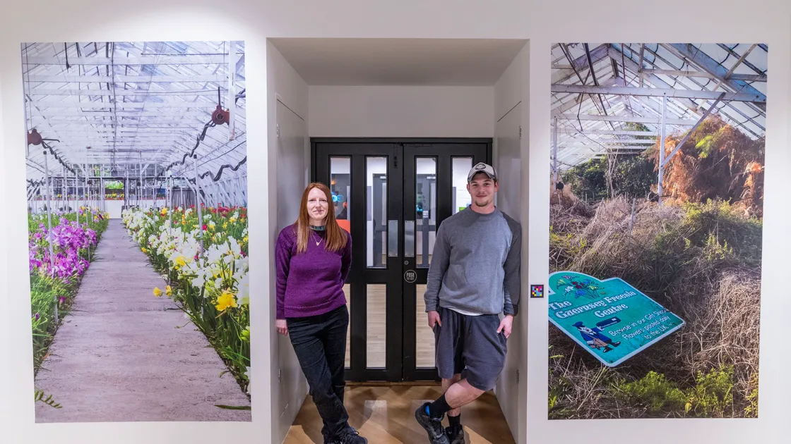 Emma Griffin and James Kail next to their large images of the Freesia Centre past and present.