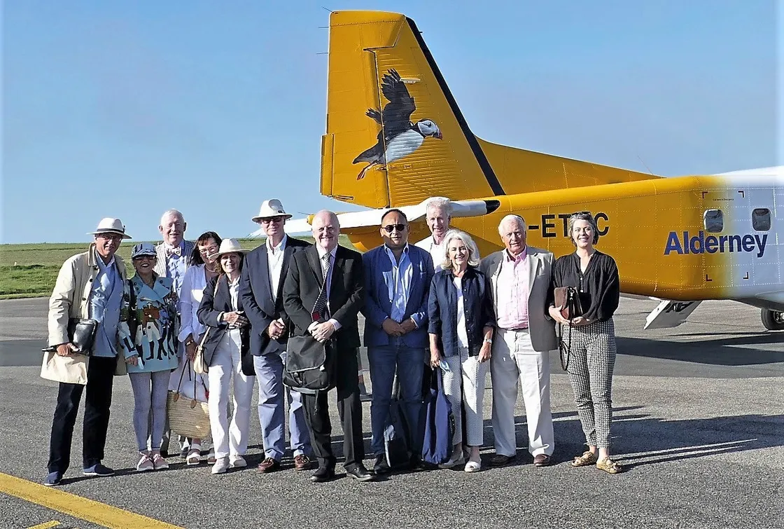 Deputies Peter Ferbrache and Chris Blin in the centre of the group of JLR Privee club members.