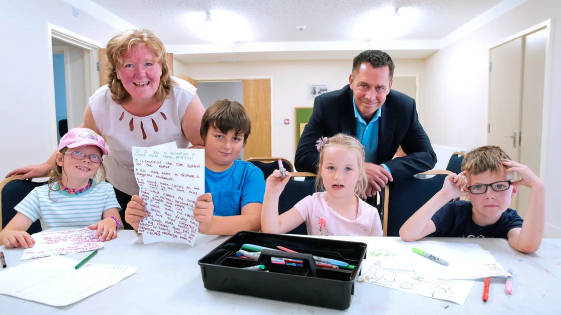 Deputies Dawn Tindall and Marc Leadbeater with children at the Rainbow holiday club held at the KGV. Children preparing manifestos and asking the deputies questions are, left to right, Emma Giles, 7, Alex Ceillam, 11, Ava Granger, 5, and Kaiden Allen, 8. (Picture by Adrian Miller, 22242881)