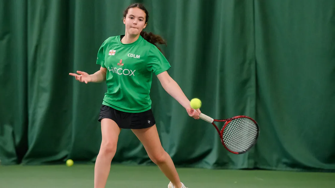 Chloe De La Mare unleashing a big forehand