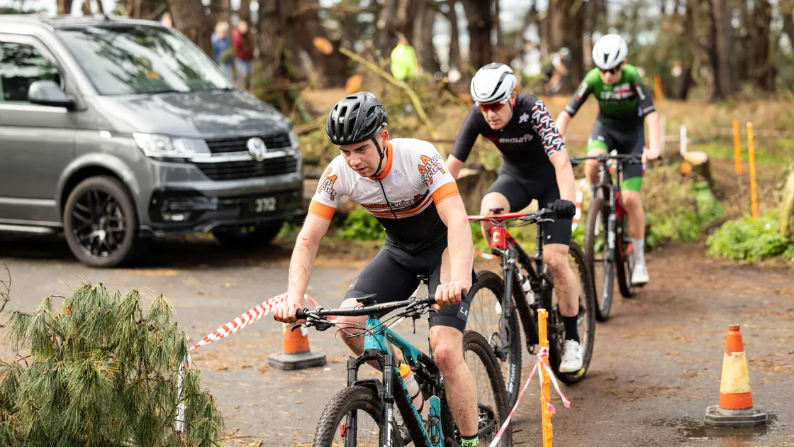 Mark Le Page leads the top riders over the tarmac crossing.