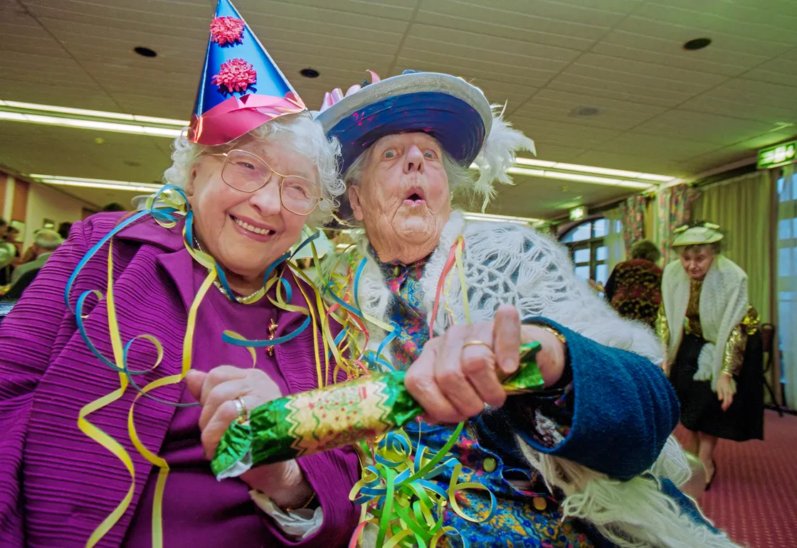 A Millennium Party for old age pensioners in January 2000 works like a dream as Chris encouraged these two centenarians – Mabel De La Mare (left) and Victoria Langlois – to ham it up a little. Charm is an essential and underrated skill for a Press photographer