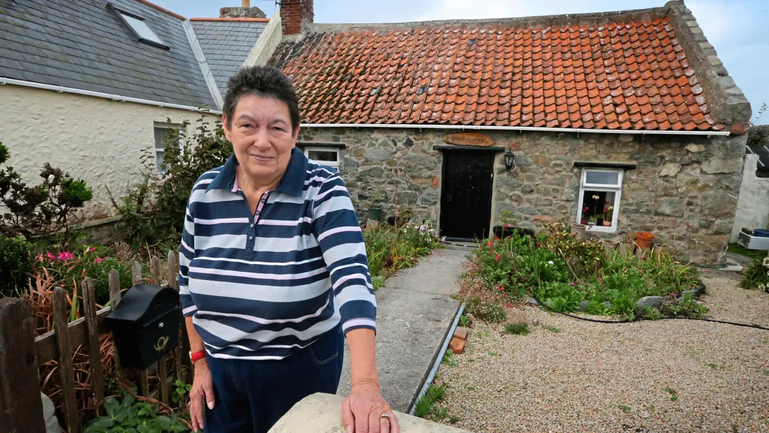 Wendy Piriou at Perelle Cottage, one of several properties added to the protected building register.
  (Picture by Steve Sarre, 22872235)