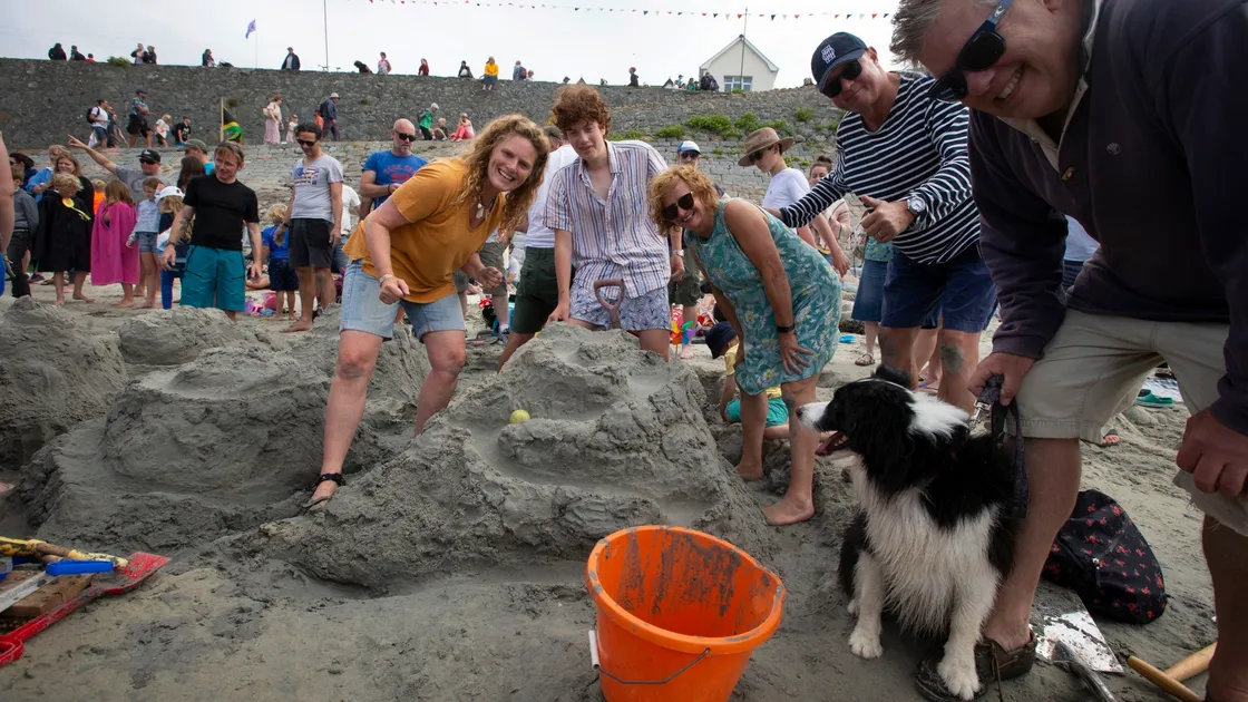 Serious sand castle making with, from left to right, Jenny Oliver, Oscar Oliver, Linda Denton, regatta lifetime patron Rick Denton, Scout the dog and Steven Oliver. (29822219)