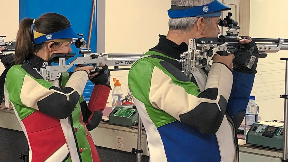 Andrea Guillou and her husband Paul side by side in the island 10m air rifle final.