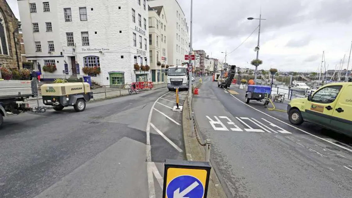 Rain delays work to restore two-lane traffic at the Quay