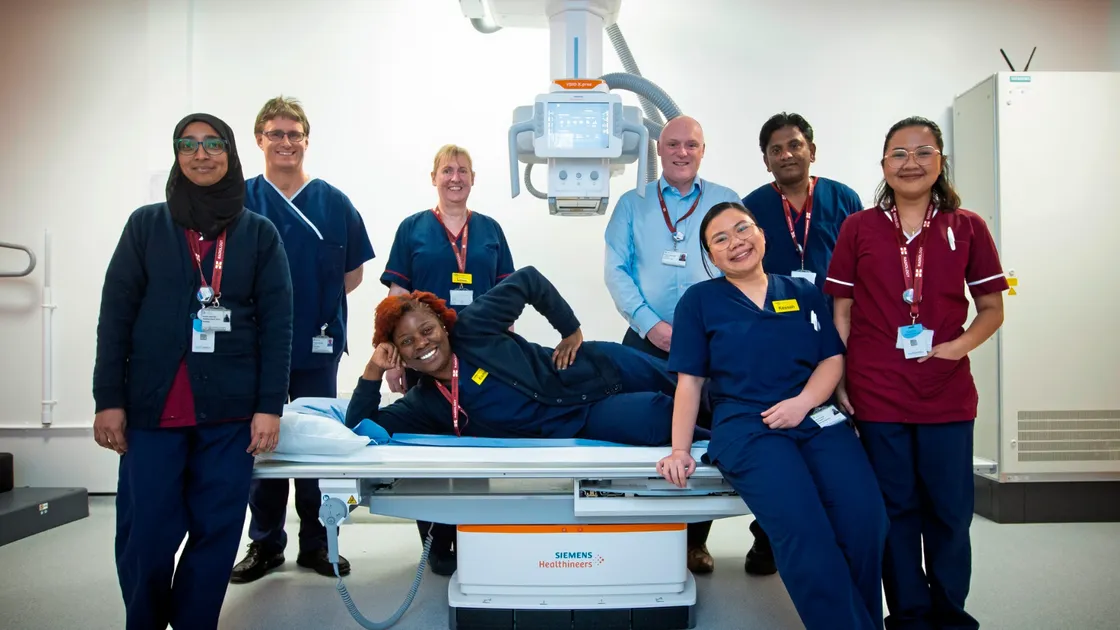 Princess Elizabeth Hospital’s radiology department. Left to right: support worker Narmeen Oozeerally, radiographer Charles Hurford, deputy manager of radiology Linda Gardner, radiographer (lying down) Esnart Banda, services manager Alistair Richards, radiographer Kessah Sombero, reporting sonographer Joseph Thomas and support worker Lexine Dianne Cebu. (Picture by Peter Frankland, 32933233)