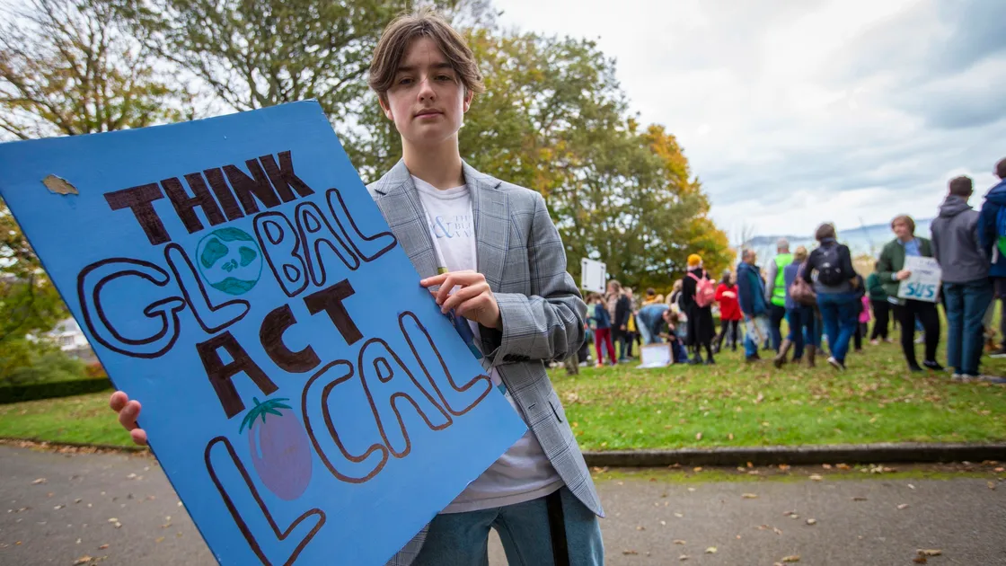 Charlie Edwards, 17, with his home-made banner. (Picture by Peter Frankland, 30169586)