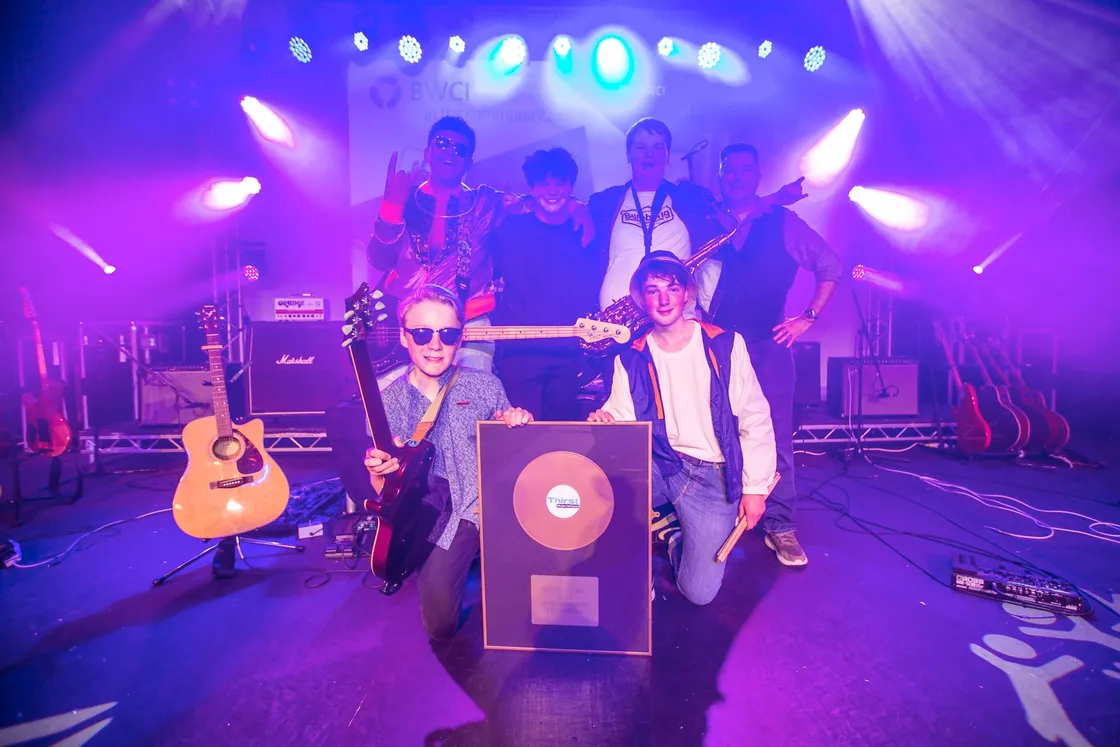 The winners of Thirst Music School's Battle of the School Bands 2021. Far From Nothing, from Elizabeth College. Back row, left to right: Bass Guitar Caleb Camp, Lead Vocals/Guitar Harry Northmore, Saxaphone/Backing Vocals Henry Whittaker. Front row, left to right: Electric Guitar Woody James and Drums Reuben Montgomery (with Thirst Music School director Wayne Mahy far right). (Picture by Sophie Rabey, 29554625)