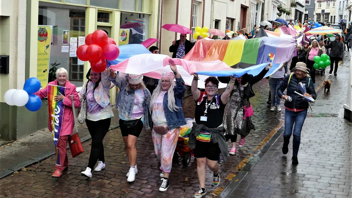 The flag carried down Victoria Street had been borrowed from Liberate in Guernsey. (Picture by David Nash)