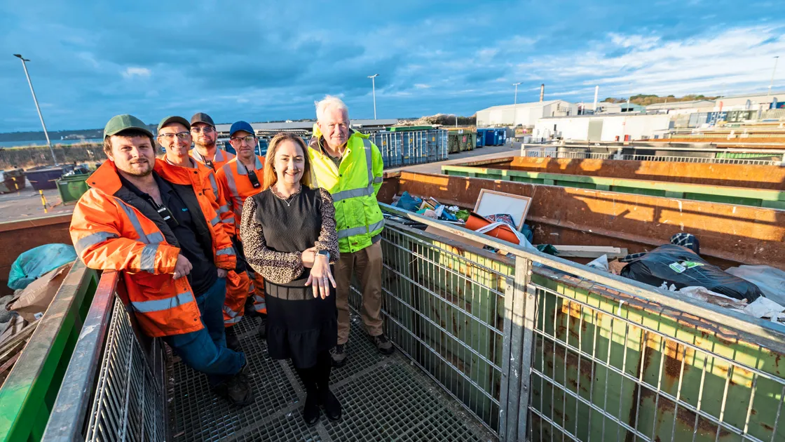 Mrs Thomas is pictured with her rings, alongside, from left to right, household waste & recycling centre staff site supervisor Zac Hall, Cliff Roussel, Tom Booth, Shane Vidamour and customer services officer Paul Corbet