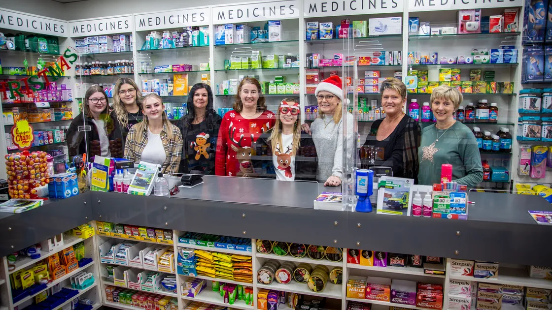 Working on with a smile and a festive jumper... Staff at local pharmacies, including the team at Stonelakes on the Bridge, are sometimes having to tell customers to wait days for prescriptions as global shortages have a local impact. (Picture by Sophie Rabey, 31551646)