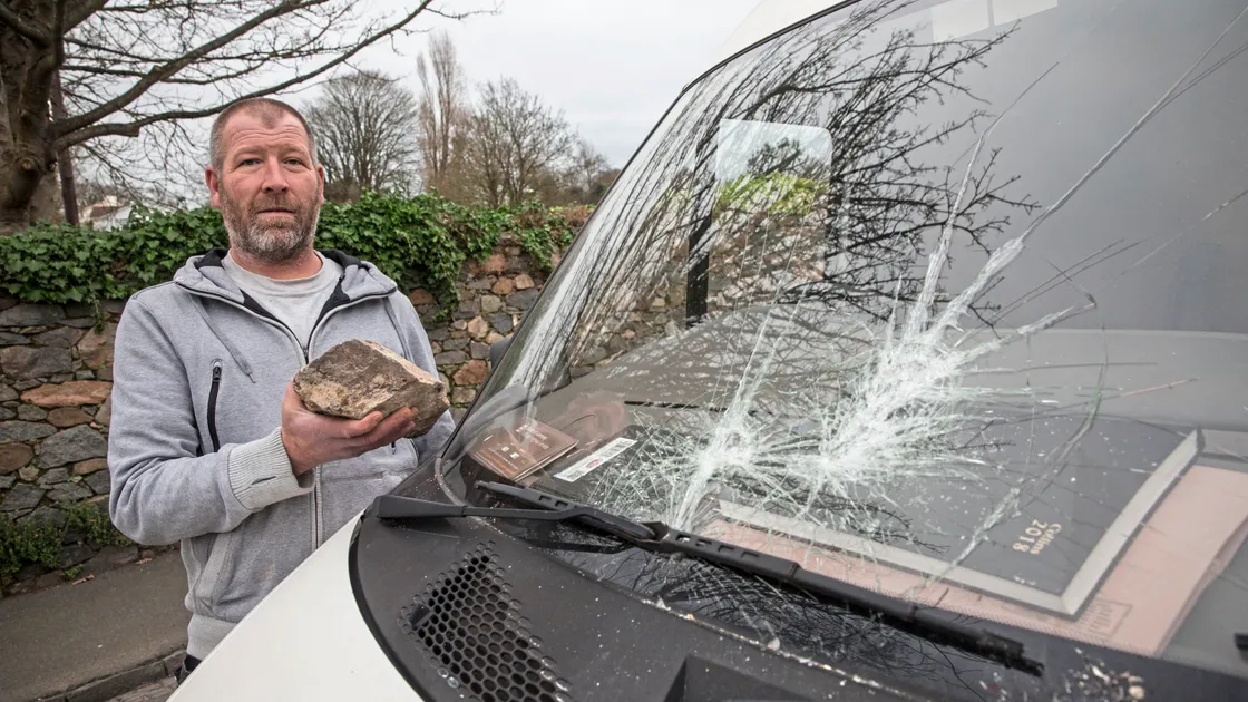 Brett Le Lievre holding the rock that was used to smash the windscreen of his van, which meant that he lost a day’s work. (Picture by Adrian Miller, 23527537)