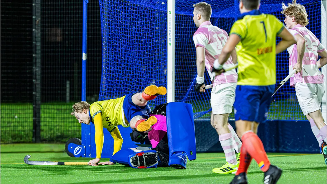 Yobbos goalkeeper Louis Day saves from Colombians forward James Ball.