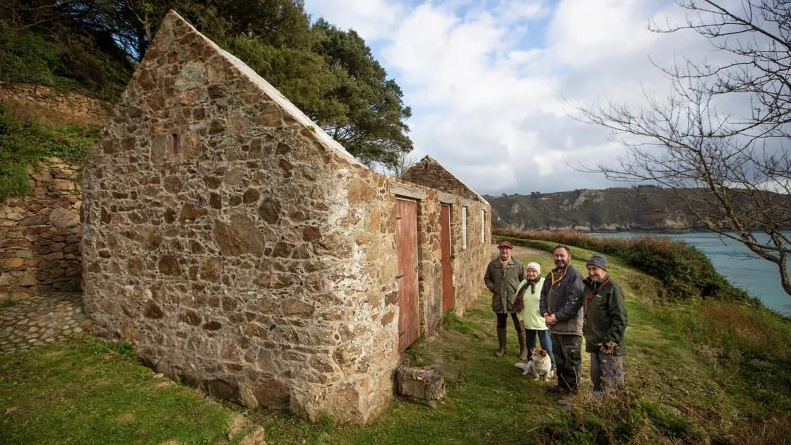 Planning permission has been granted for a derelict cottage at Moulin Huet, which featured in a Renoir painting, to be restored and used as self-catering accommodation. Pictured, left to right, architect Andrew Dyke with owners Maisie, Nik and George Le Page with their dog Petra.(Picture by Peter Frankland, 30233161)