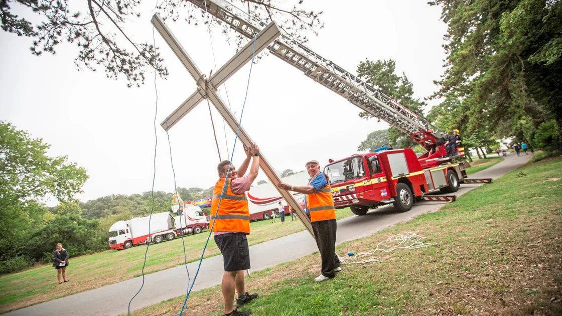 The Fire & Rescue Service’s turntable ladder was used to help erect the symbol of the North Show, a 10ft wooden cross.                                 (Picture by Peter Frankland, 22318969)