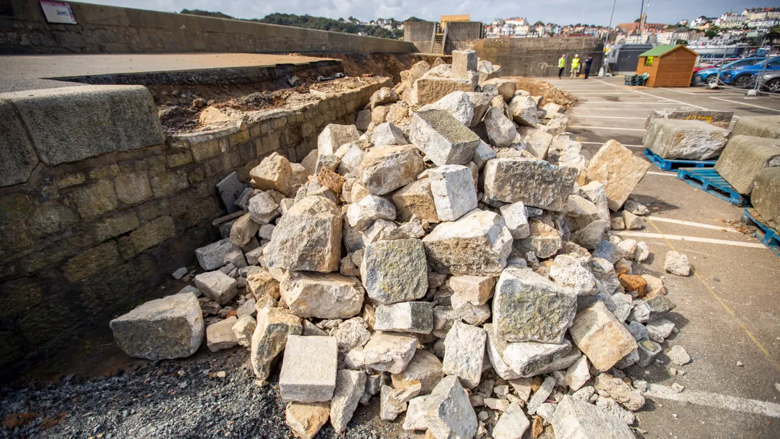 Guernsey Ports project manager Joe Armstrong, inset, has promised that the Castle Emplacement walkway will look just as it did before work started on strengthening it, including returning all of these granite blocks. (Pictures by Sophie Rabey, 32476356 