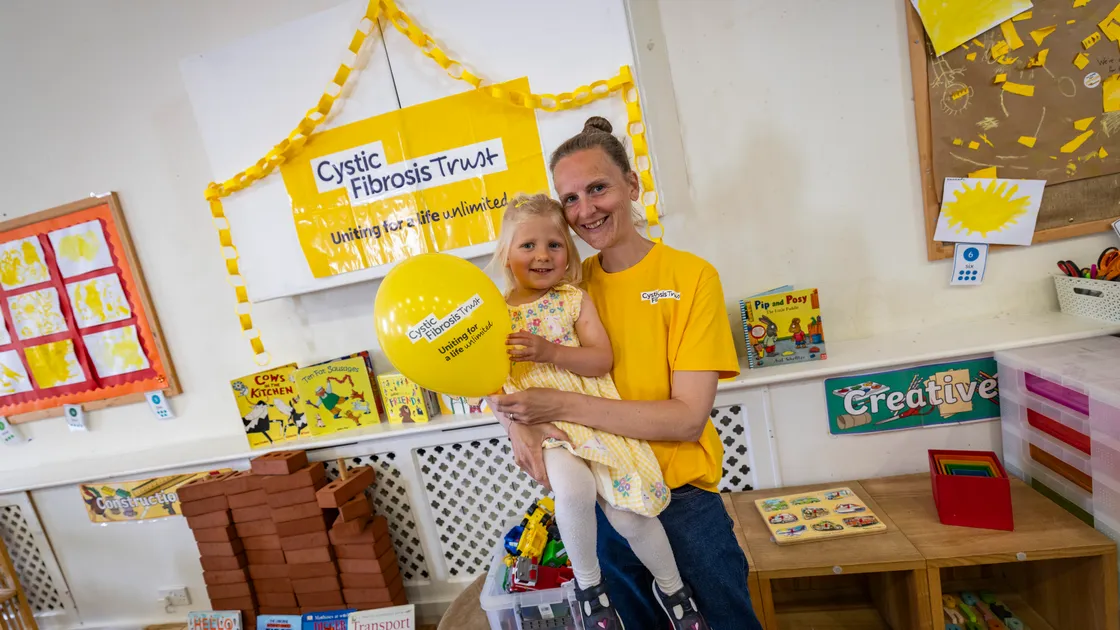 Four-year-old Martha Ogier, who has cystic fibrosis, with her mum Sarah Ogier at Stepping Stones Pre-school, which has gone yellow for Cystic Fibrosis Awareness Week.