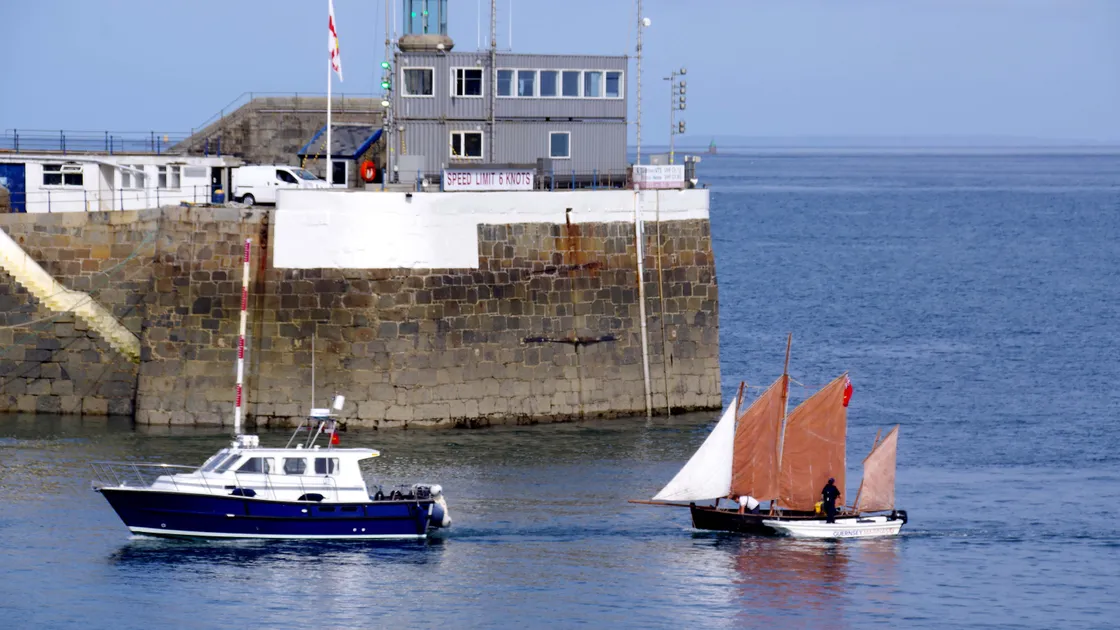 Local boat Amari Too towing Vigilo into St Peter Port Harbour, after a five-and-a half hour trip from Carteret in France.
