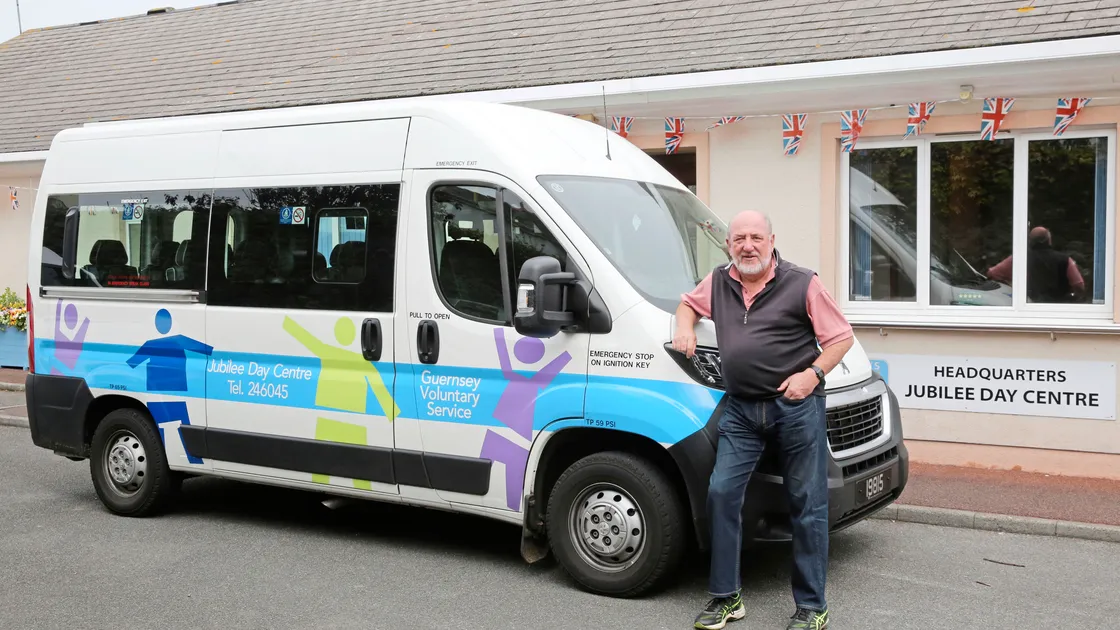 Transport administrator Colin McGregor outside the Guernsey Voluntary Service’s Jubilee Day Centre headquarters with one of the three minibuses it uses to take senior islanders there and to The Russels. Its £19,000 Christmas lottery grant will pay for their running costs and for those of the four Meals on Wheels cars. (Picture by Adrian Miller, 24629997)