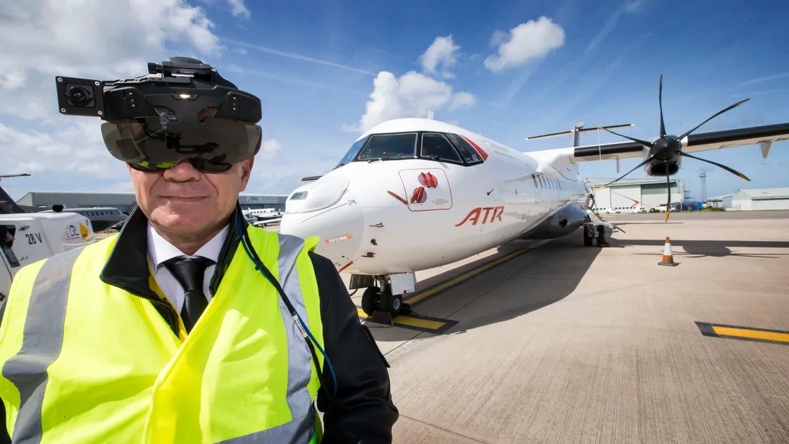 Captain Eric Delesalle with the new ClearVision Enhanced Vision System head set, which uses an external camera to display an augmented outside-view in real-time to allow planes to fly in fog. (Picture By Steve Sarre, 22019658)