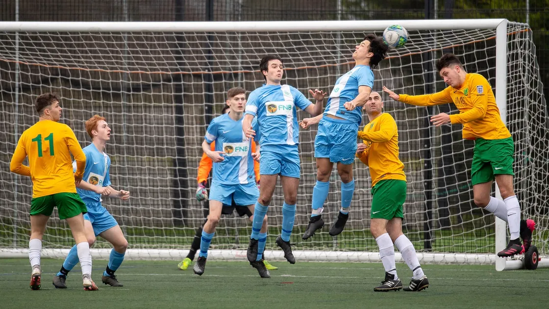 The Island Under-18s defend a high ball into box against Vale Rec at the KGV. (Picture by Andrew Le Poidevin, 30444583)