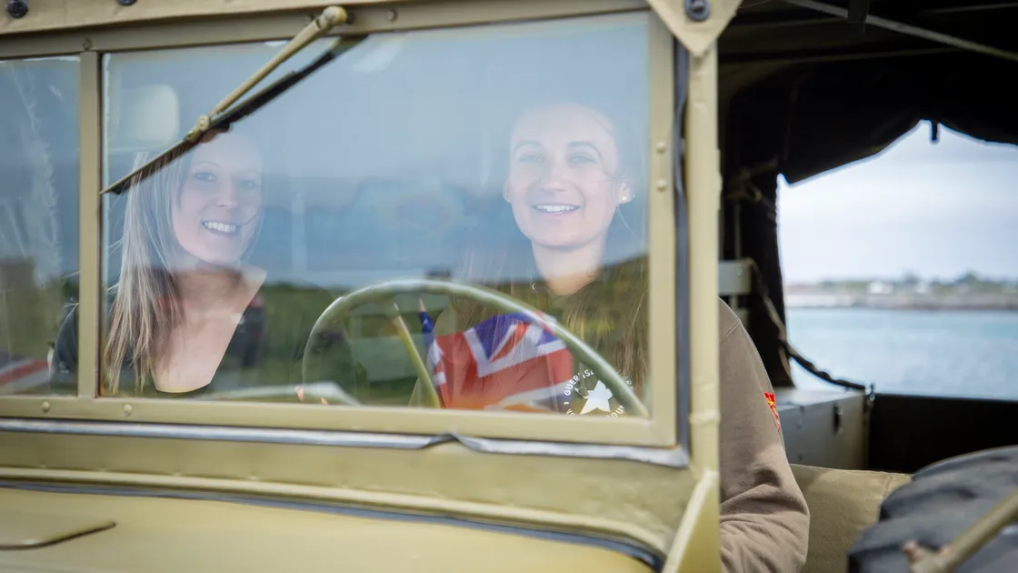 Picture by Sophie Rabey.  04-05-20.  Guernsey Military Vehicle Group have had to change their plans that they had in place for the 75th Liberation Day here this year because of Coronavirus Lockdown.  Instead of the usual cavalcade they will be posting videos on their social media throughout the day to show islanders some of their members military vehicles.  Dyer family, L-R Sophie and Laura Dyer.. (28240582)