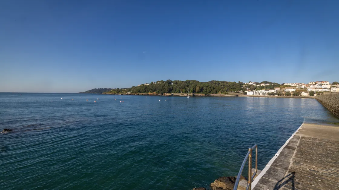 The man died after he was reported shouting for help in the water at Havelet Bay on Monday evening.