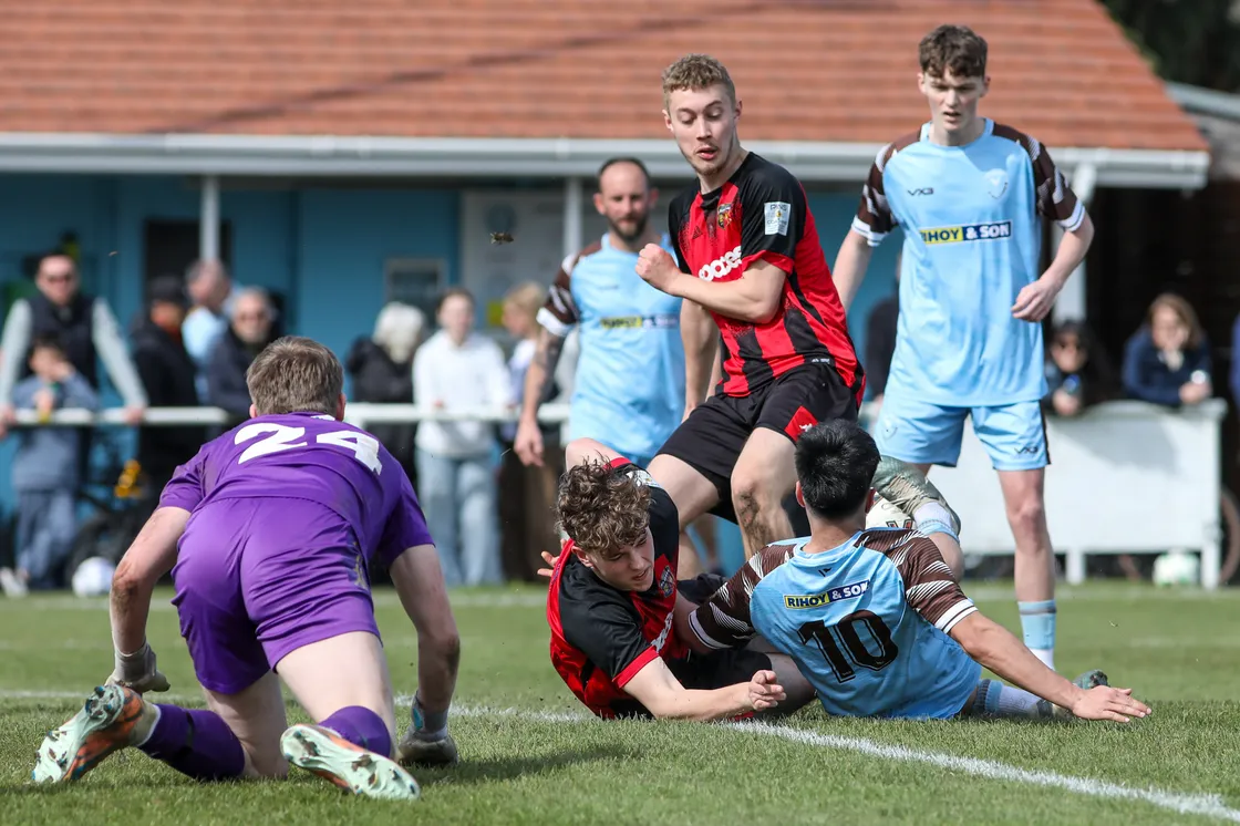 Alex Mourant makes a last-ditch tackle to prevent Jake Martin from scoring.