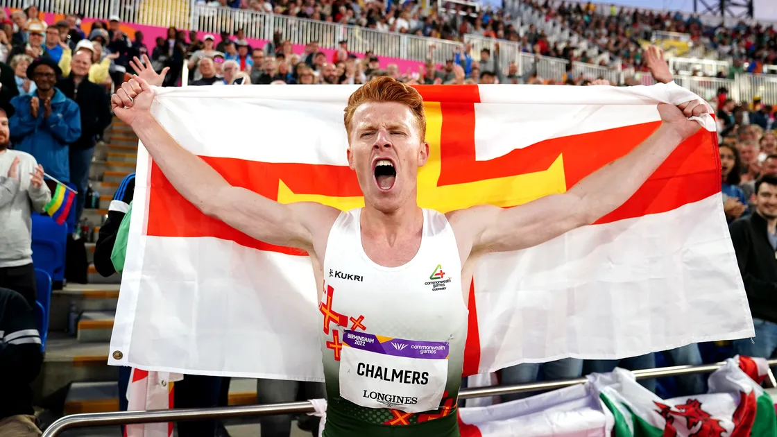 Alastair Chalmers celebrates winning a bronze medal in the men's 400m hurdles at the Birmingham 2022 Commonwealth Games.