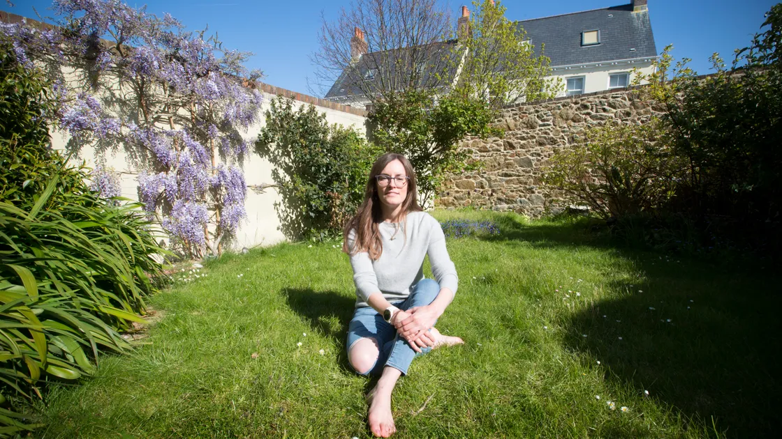 Madeleine Norman in her garden in Hauteville. She is concerned about the increasing use of plastic grass and is encouraging people to use the real thing for their lawn. 	(Picture by Adrian Miller, 29484396)