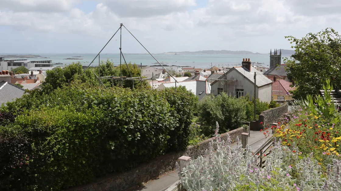 Scaffolding was set up on the Rouge Rue, St Peter Port, site to show the height of the proposed properties set out in the original application as above. After those plans were rejected by planners, new plans with a reduced height for three of the homes were passed.    (Picture by Adrian Miller, 19418155)