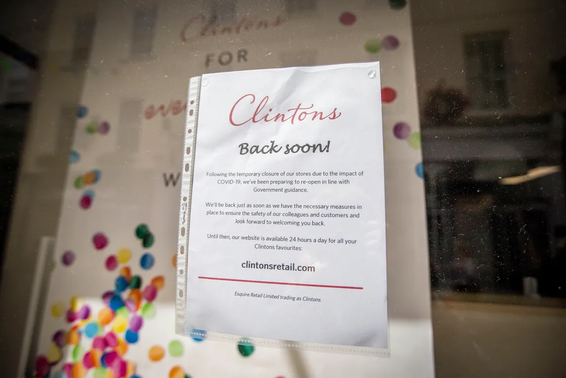 A sign in Clintons Cards directs customers to its website. (28340412)
