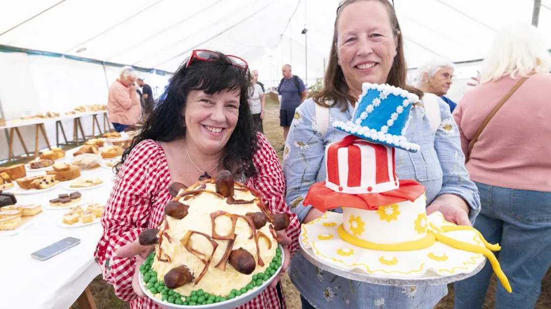 Chief cake taster Juliet Veron, left, with Faye Pedersen and two of her prizewinning creations. 